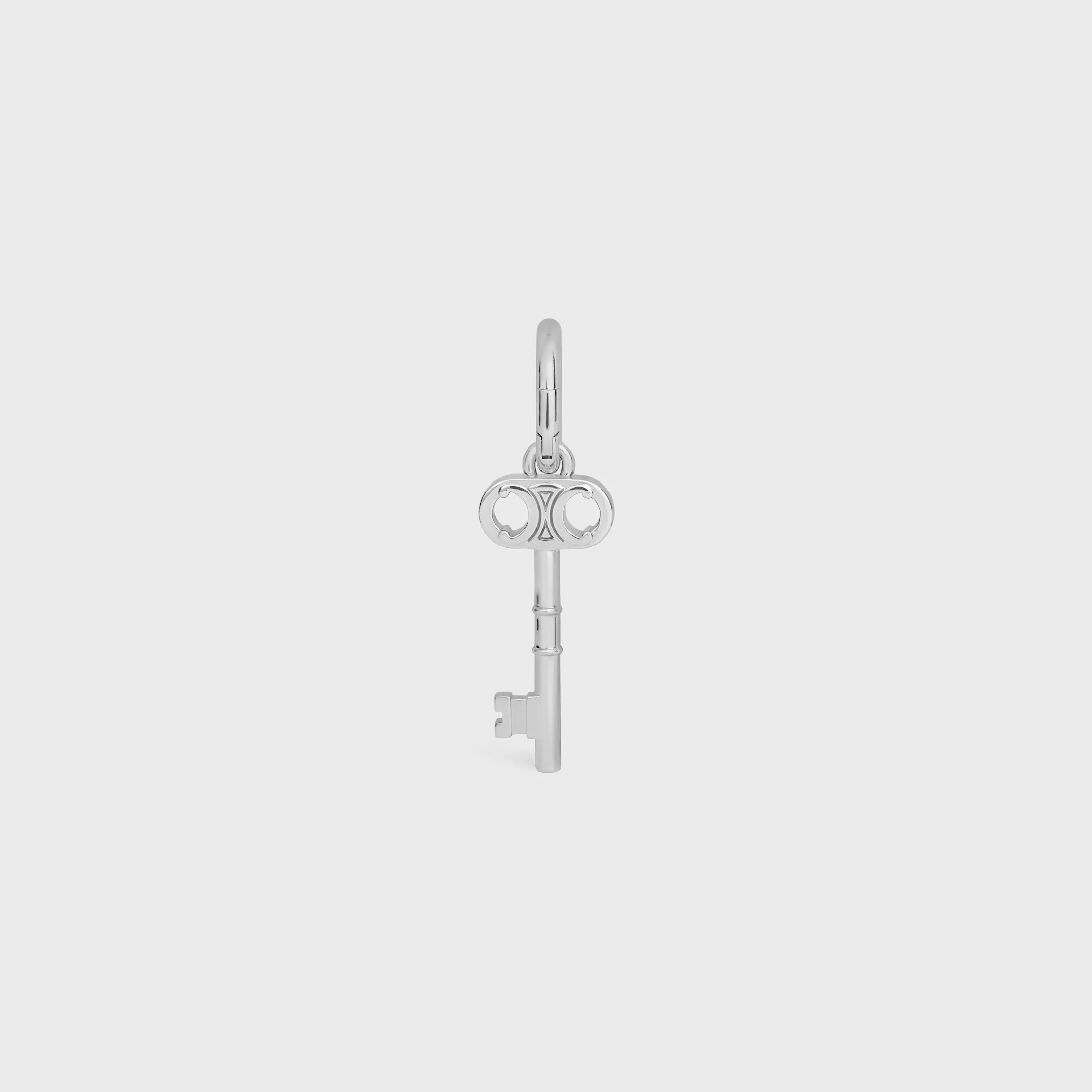 CHARMS TRIOMPHE LLAVE EN LATÓN CON ACABADO EN RODIO