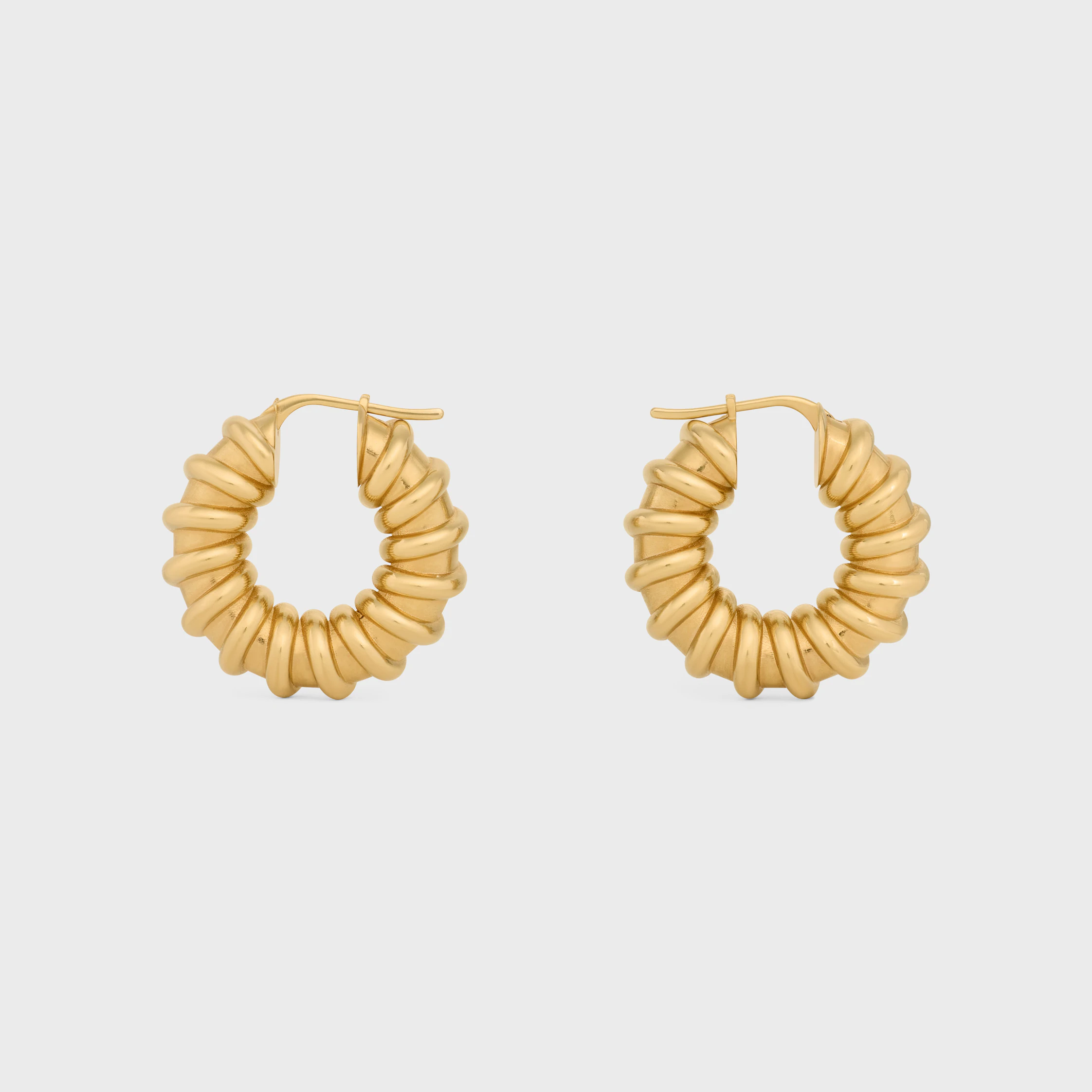 Celine Défilé Torsade Aros en latón con acabado dorado