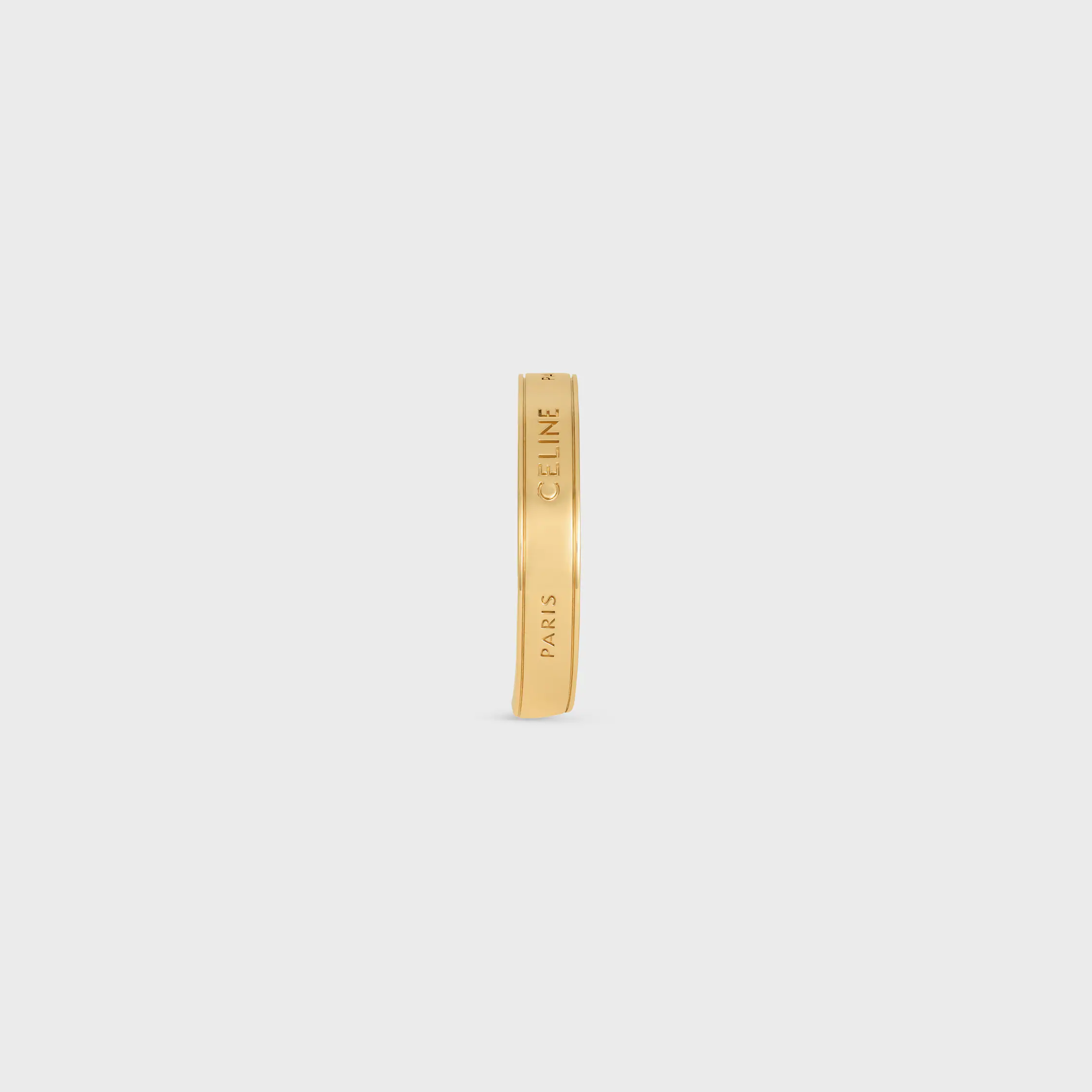 Pulsera pequeña de cinta Celine en latón con acabado dorado