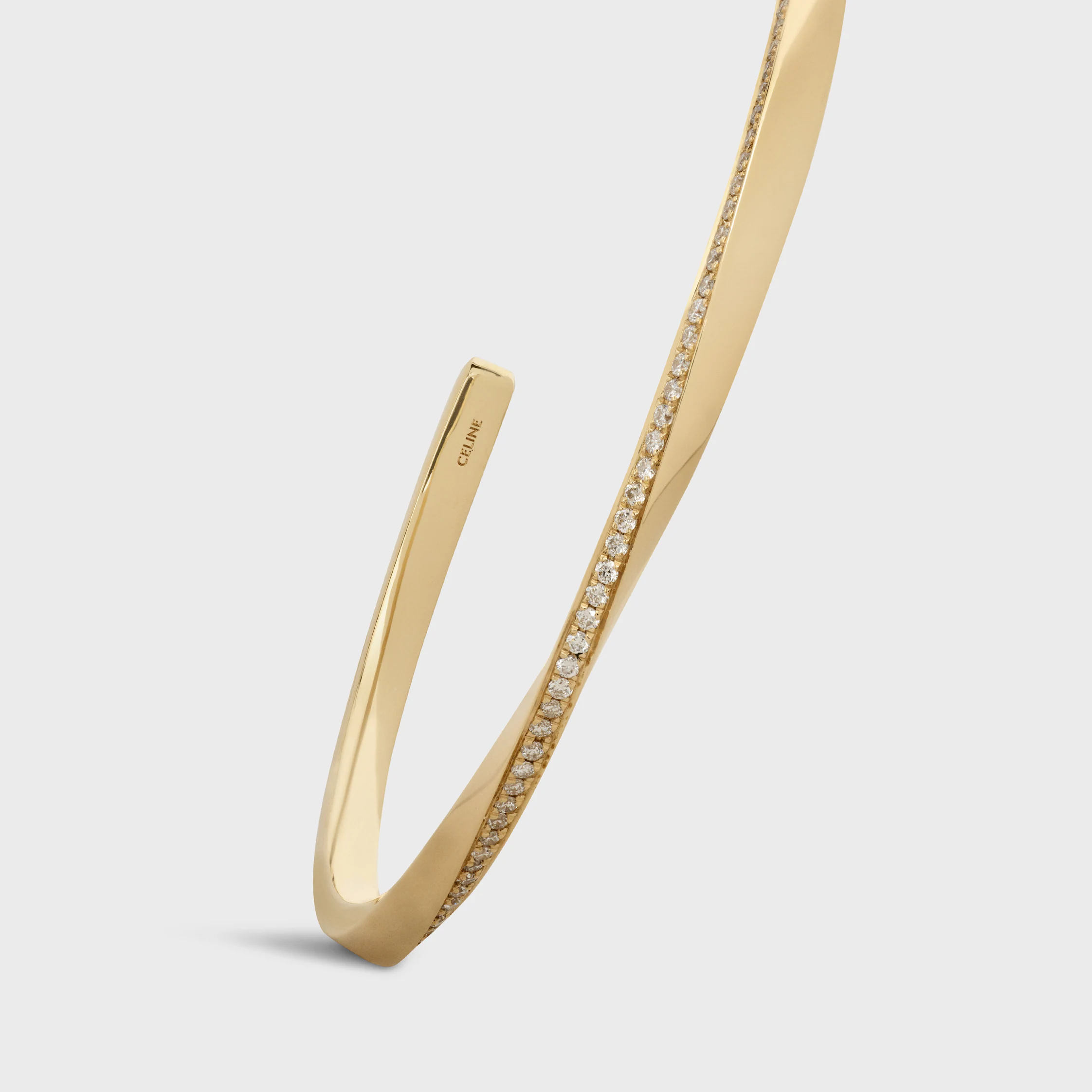 Pulsera de torsión en oro amarillo y diamantes