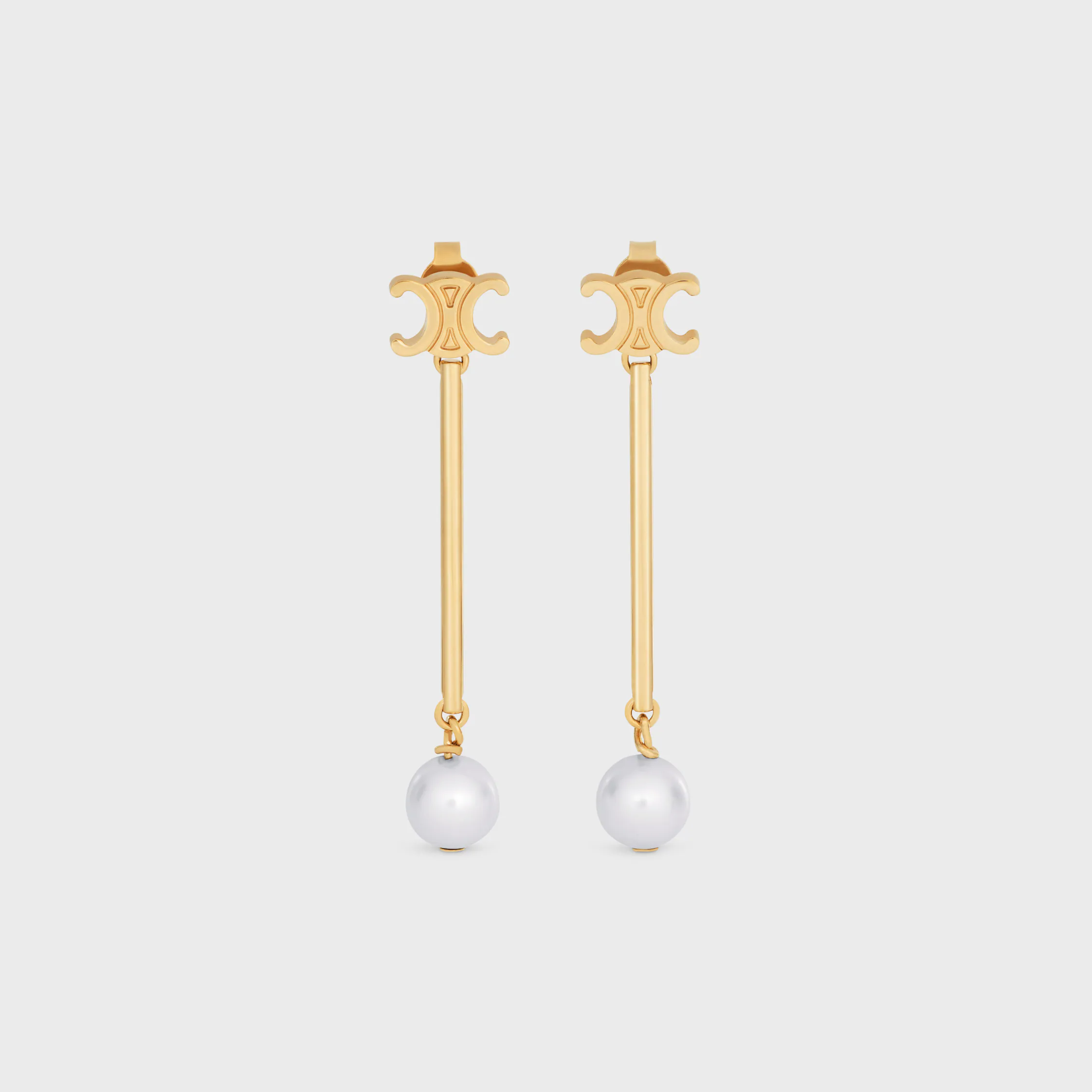 Los aretes rectos Les Perles Celine en perlas de resina y latón con acabado dorado