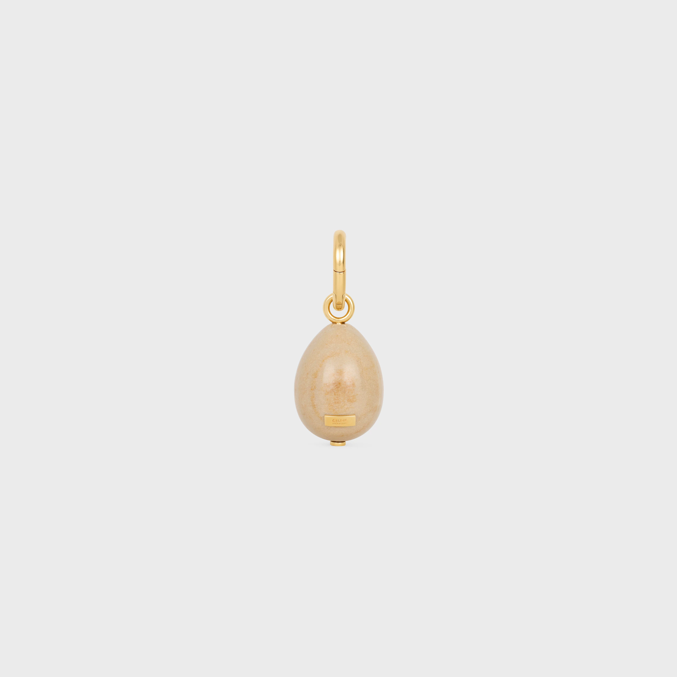 CHARMS HUEVO DE PIEDRA EN BOTTICINO Y LATÓN CON ACABADO EN ORO