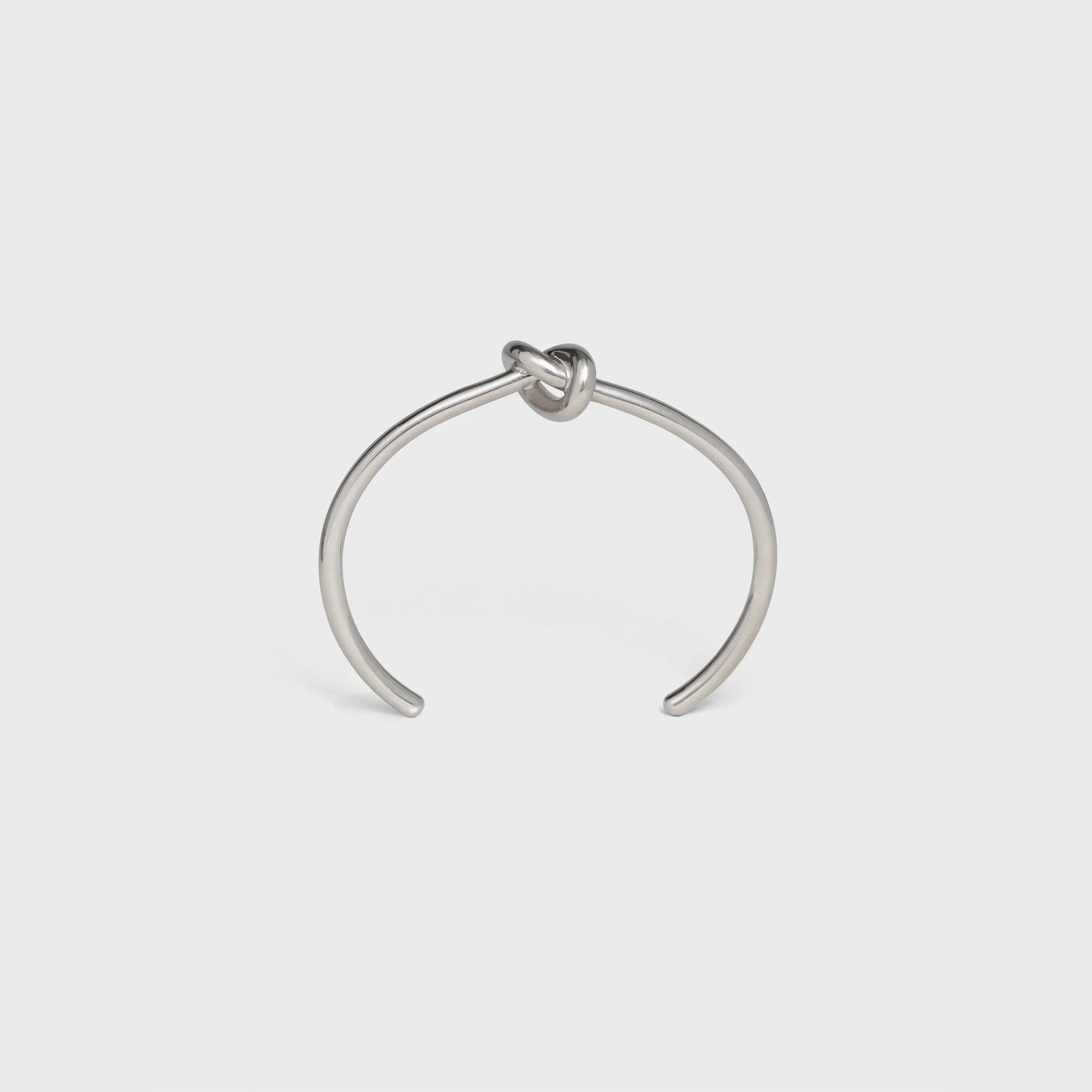 Brazalete extrafino con nudo en latón con acabado rodio
