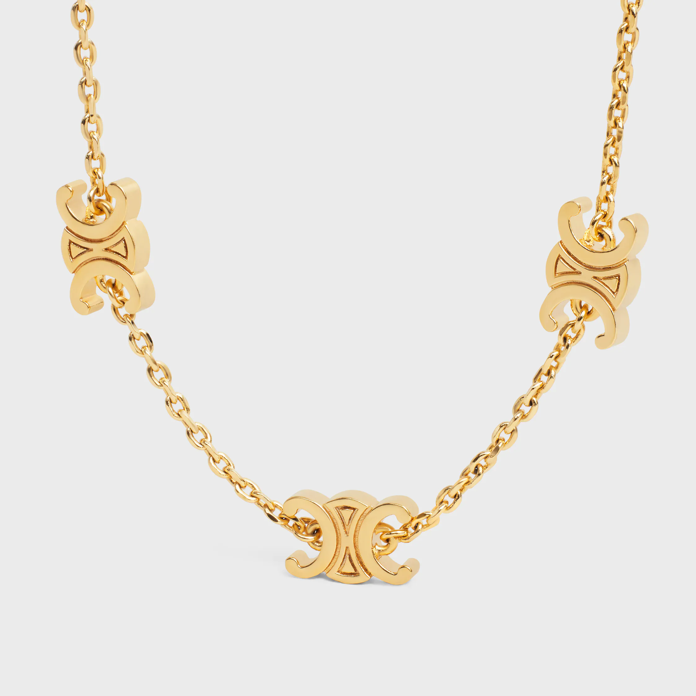 Pulsera Triomphe Mini Triomphe en latón con acabado dorado