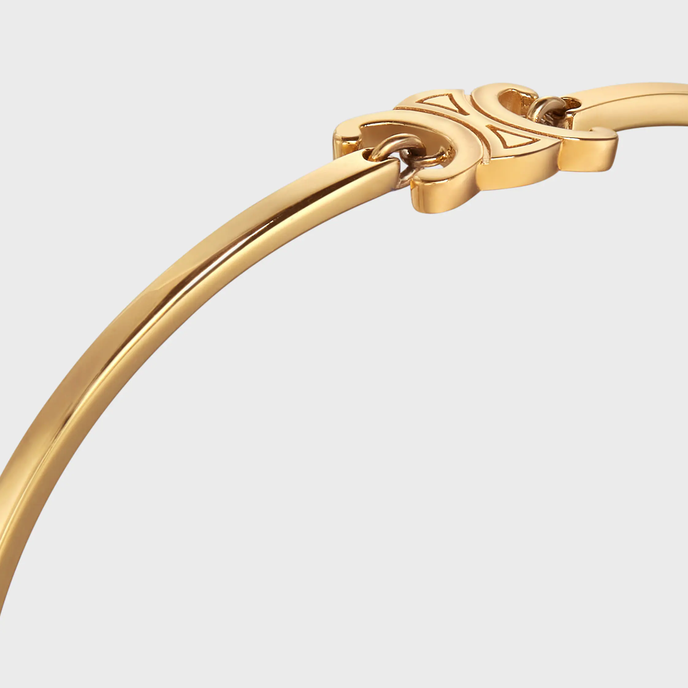 Pulsera articulada Triomphe en latón con acabado dorado