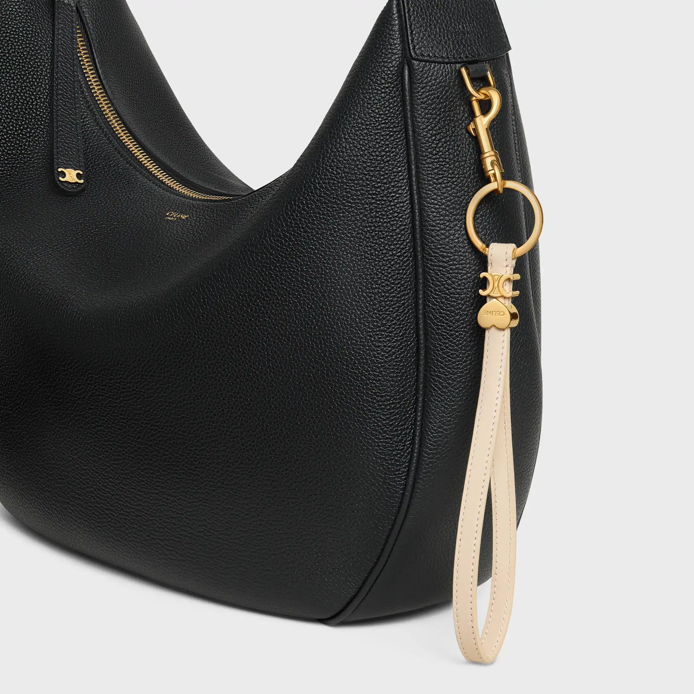 TRIOMPHE CHARM EN CUERO DE TERNERA LISO